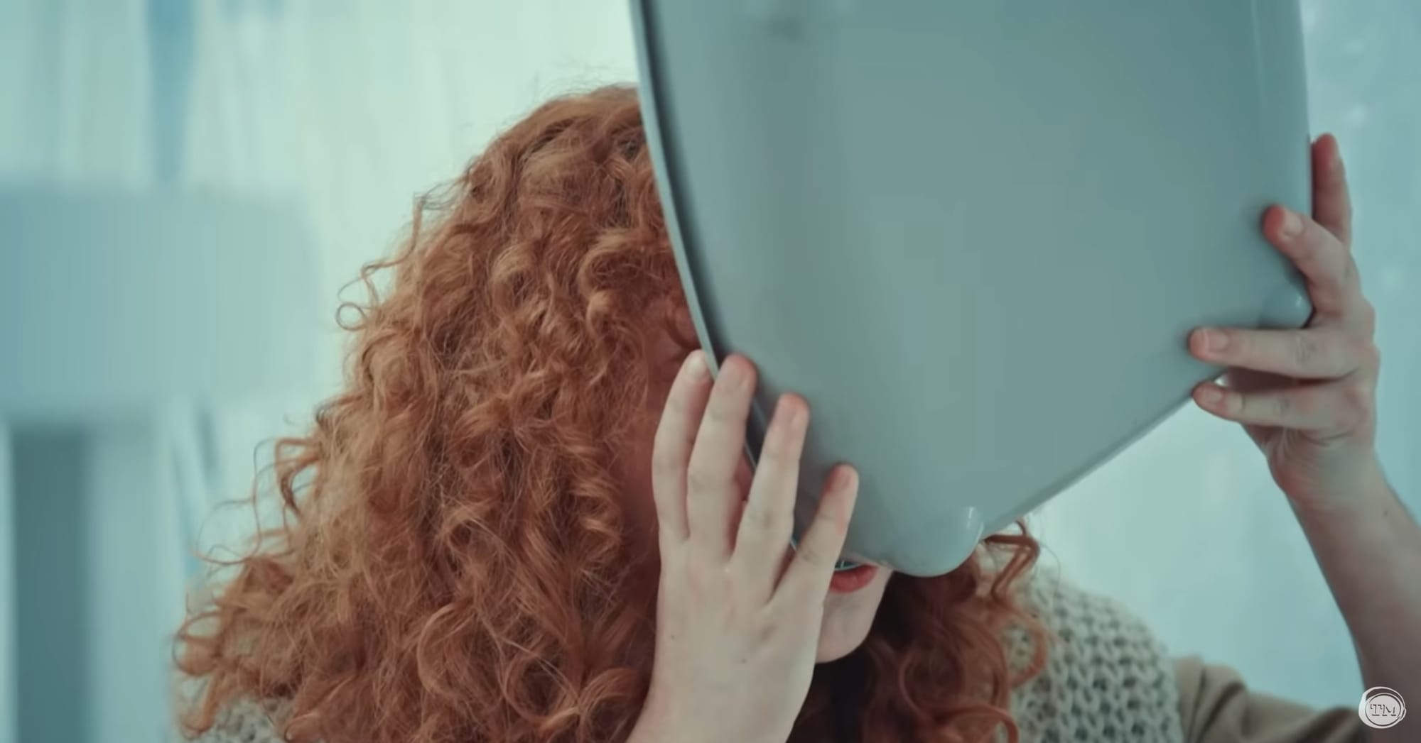 Ania Magliano drinks apple juice from a litter box
